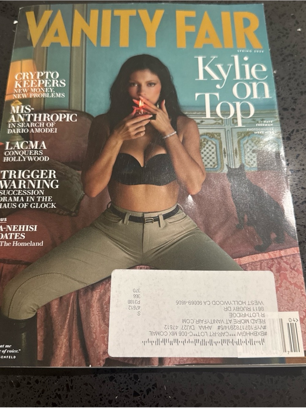 Vanity Fair Cover with Bold Yellow Masthead and Teal Background magazine